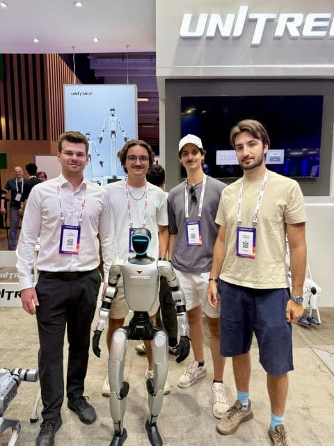 Felix Bergmann and colleagues with a Unitree humanoid robot at VivaTech